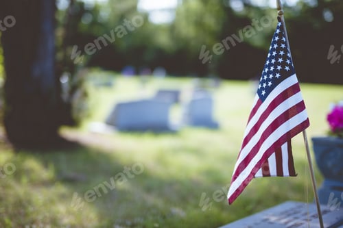 Preview: American Flag Placed Beside a Tombstone