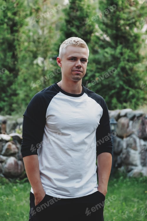 Preview: Portrait young man walking in nature