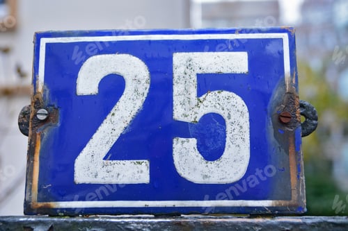 Preview: Closeup shot of the number twenty five sign on a blue background