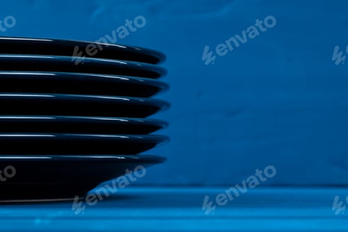 Preview: Dark blue crockery on blue wooden background