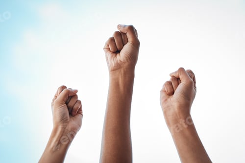 Preview: Shot of an unrecognisable group of women raising her hand in strength outside