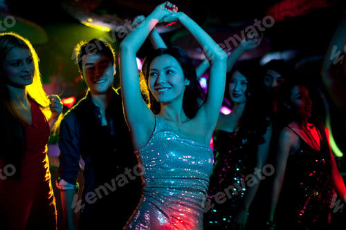 Preview: Stylish young people dancing in nightclub