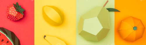 Preview: panoramic shot of various handmade origami fruits on multicolored paper stripes