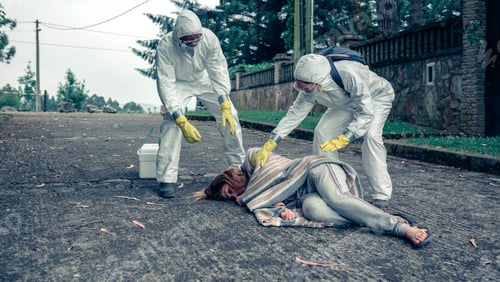 Preview: Doctors in protection suits caring for a woman