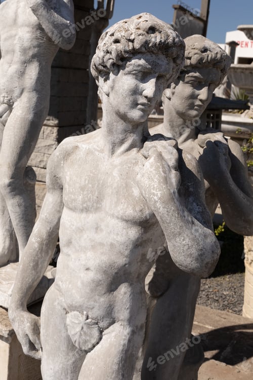 Preview: Ancient stone sculptures of naked men in reclamation yard