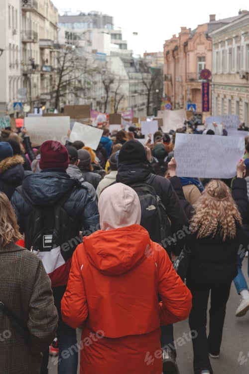 Preview: People walk with placards during feminist protest.