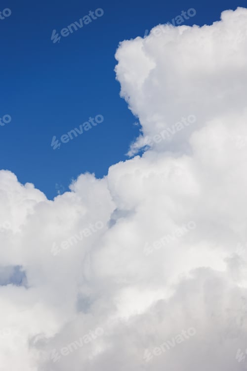 Preview: white cumulus clouds in blue sky, beautiful view of the sky and storm clouds. Huge majestic cloud