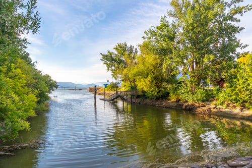 Preview: Small wooden pier reflecting on the shuswap lake in salmon arm, british columbia