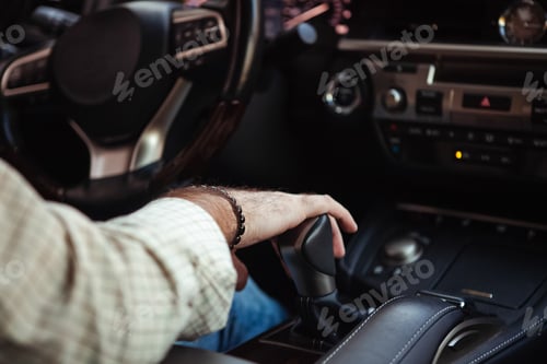Preview: middle aged man driving a car