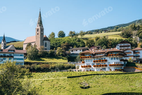 Preview: Church on a mountain overlooking valley in Villandro, Dolomites, Italy