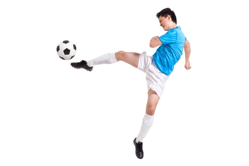 Vista previa: Chinese soccer player kicking while jumping