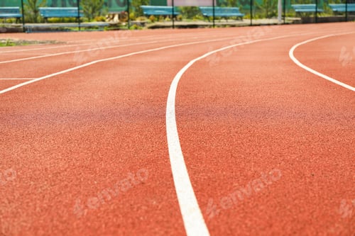 Preview: Red running track with white lines outdoor, copy space