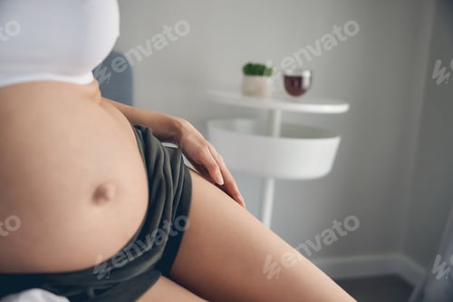 Preview: Portrait of pregnant belly on the third trimester