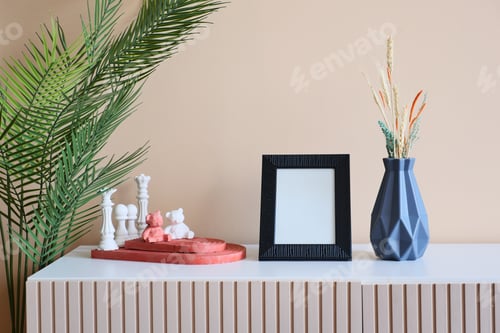 Preview: Black frame mockup on cabinet in front of the empty clean