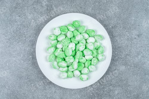 Preview: Hard green candies on white plate