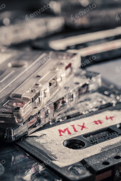 Preview: Antique pile of cassette tape on wooden table