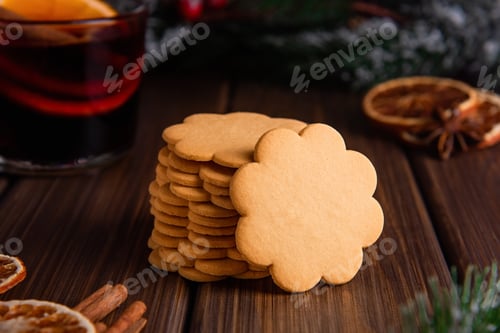 Preview: Stack of flower-shaped gingerbread cookies with warm drink