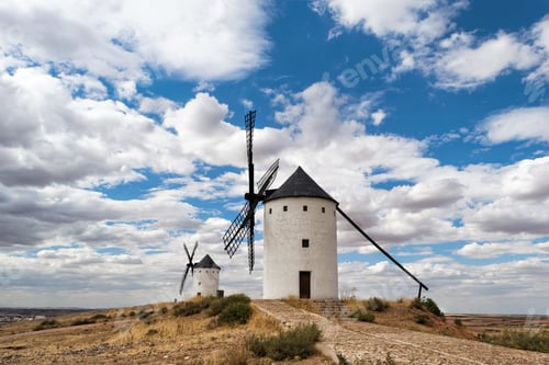 Preview: Windmills against a cloudy sky in Castilla-La Mancha, Spain