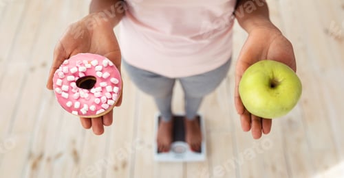 Preview: Healthy vs unhealthy food. Black woman holding apple and donut on scales, making choice of her meal