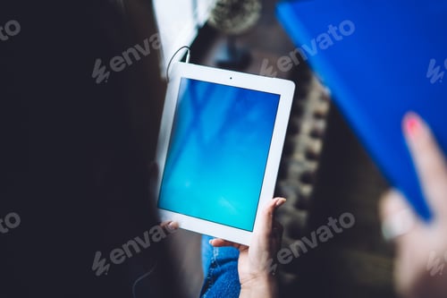 Preview: Tablet in hands of female worker