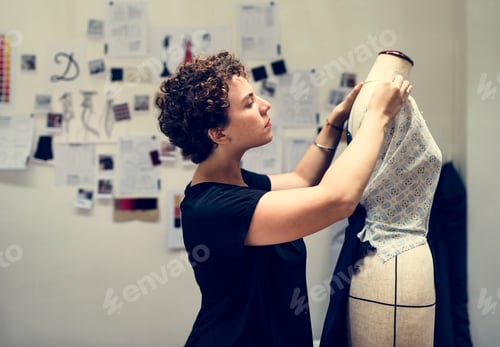 Preview: Woman checking on a dress