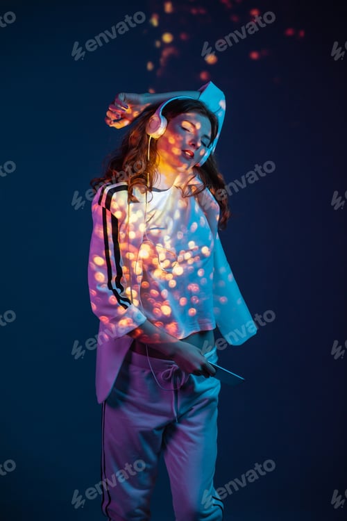 Preview: Woman enjoying music with smartphone