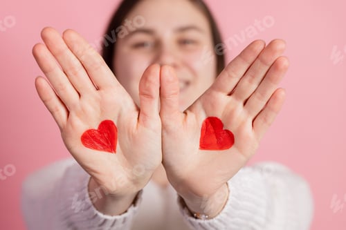 Preview: hands with drawn hearts, valentine's day concept