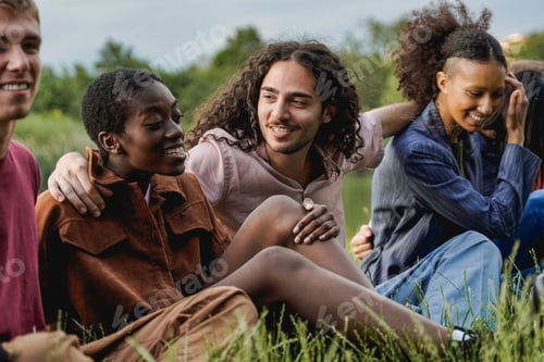 Preview: Happy multiracial group of friends having fun outdoor at park city - Focus on hipster guy face
