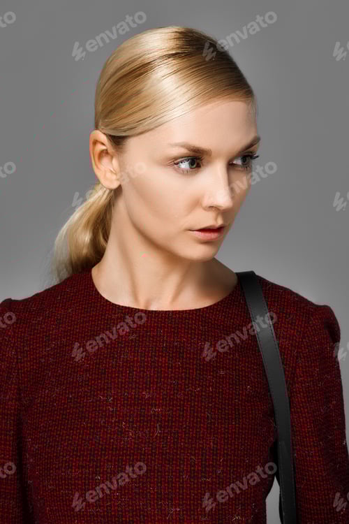 Preview: Woman in Textured Dress with Shoulder Bag