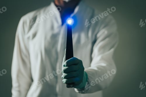 Preview: orthodontist doctor holding a photopolymerization lamp