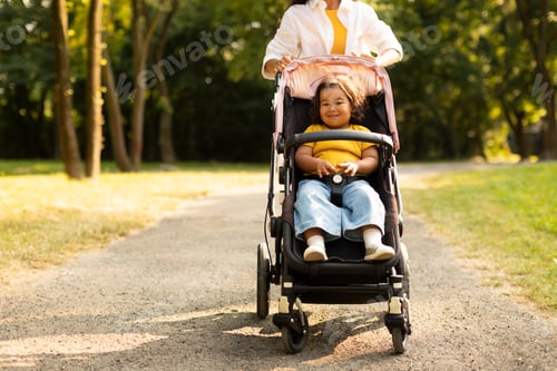 Preview: Asian Mommy Going With Baby Daughter in Stroller At Park