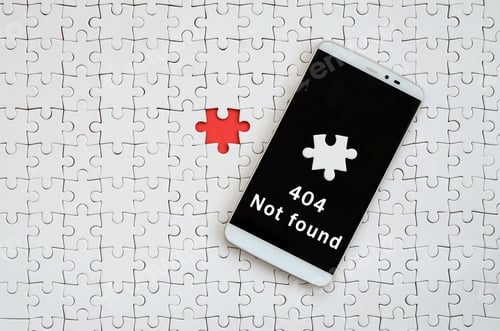 Preview: A modern big smartphone with a touch screen lies on a white jigsaw puzzle in an assembled state with