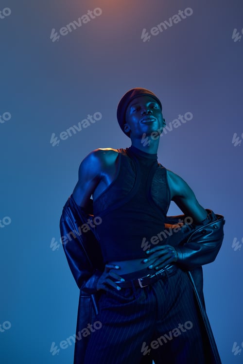 Preview: Stylish young man radiates confidence in a vibrant, artistic atmosphere