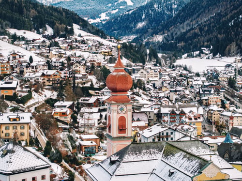 Preview: Aerial drone view of the Ortisei town covered in snow in northern Italy