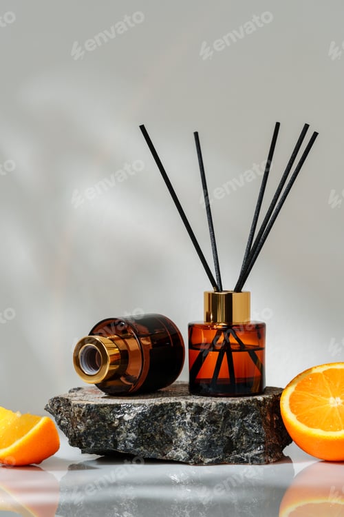 Preview: Modern Aromatherapy Diffuser With Orange Accents on a Natural Stone Surface