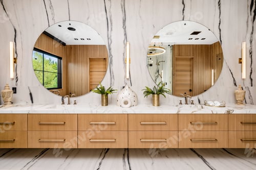 Preview: Modern bathroom with double vanity and round mirrors.