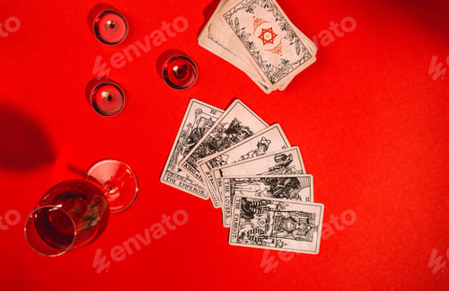 Preview: Tarot cards on red background, occult and magic
