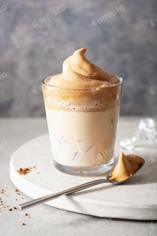 Preview: dalgona coffee in glass. trendy Instant coffee whipped with sugar and hot water
