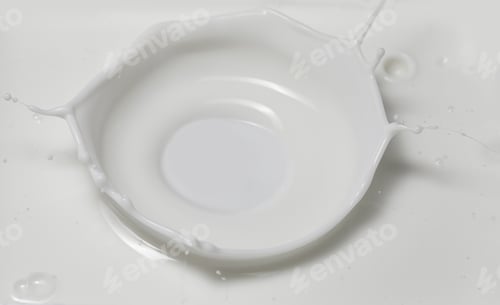Preview: Fresh milk pouring making a crown splash in a milk pool. Top view, isolated on grey-white background