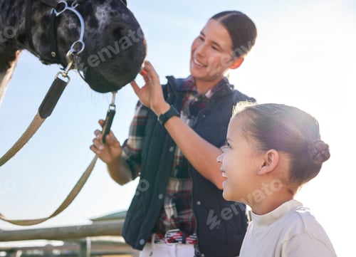 Preview: Cropped shot of an attractive young woman and her daughter petting a horse outside on the ranch