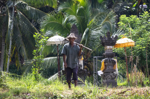 Preview: Man in straw hat and top hat with a cane standing on dirt road