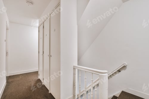 Preview: Wooden staircase in spacious hall of apartment