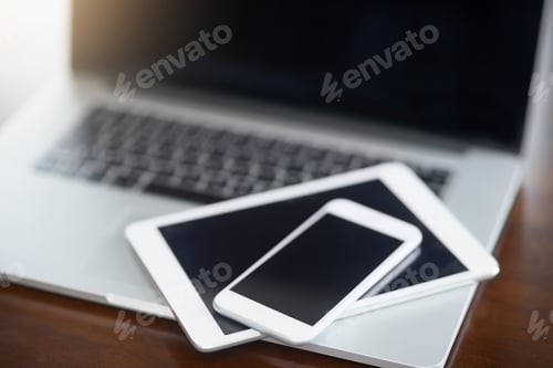 Preview: Digital devices at the ready. High angle shot of various digital devices on a table.