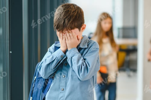 Preview: School friends bullying a sad boy in corridor at school