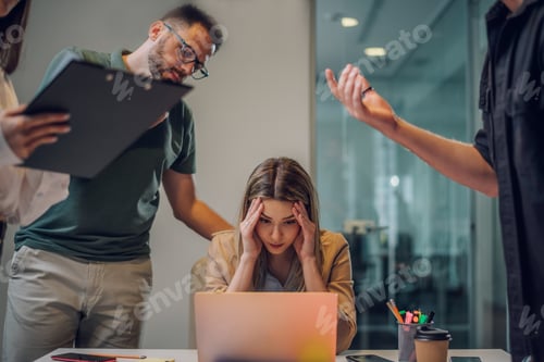 Preview: Stressed business colleagues having a meeting in an office and solving problems