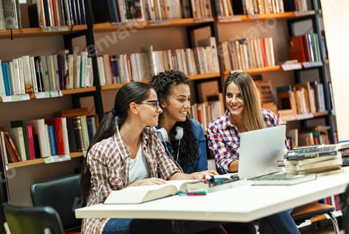Preview: Group of female students study in the college library.