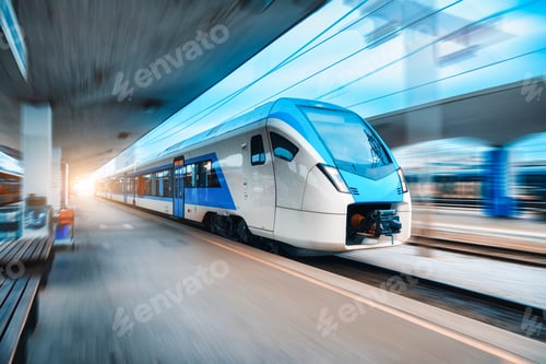 Preview: Blue high speed train in motion on the railway station
