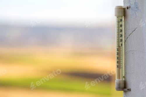 Preview: Thermometer celsius showing cold temperature on blurred background. Weather forecast concept.