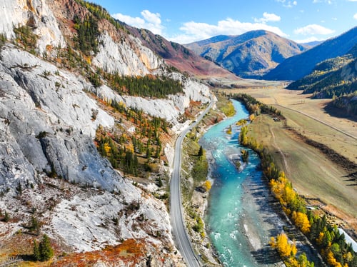 Preview: Road and river flowing through a colorful autumn mountain gorge