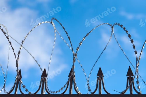 Preview: Barbed wire on fence, steel grating fence with barbs
